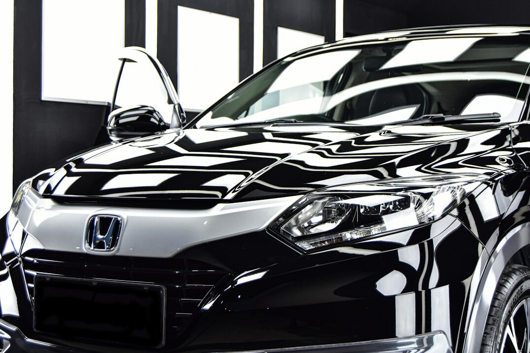 Black car with deep gloss paint after polishing