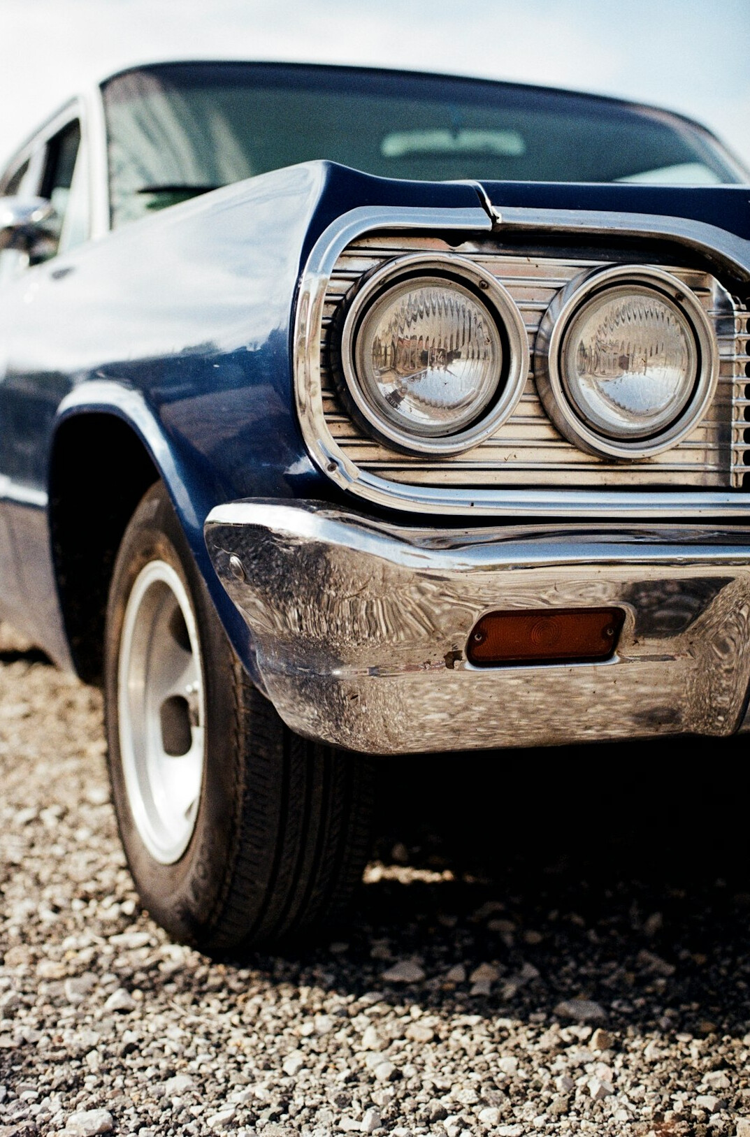 Front of a muscle car with stone chips on the bumper