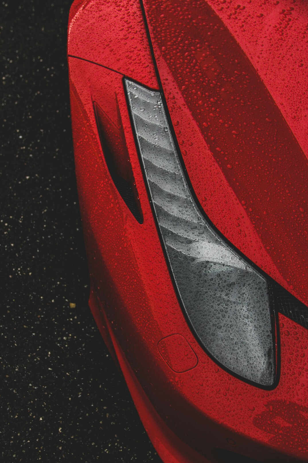 Sports car body panel with fine scratches in the light