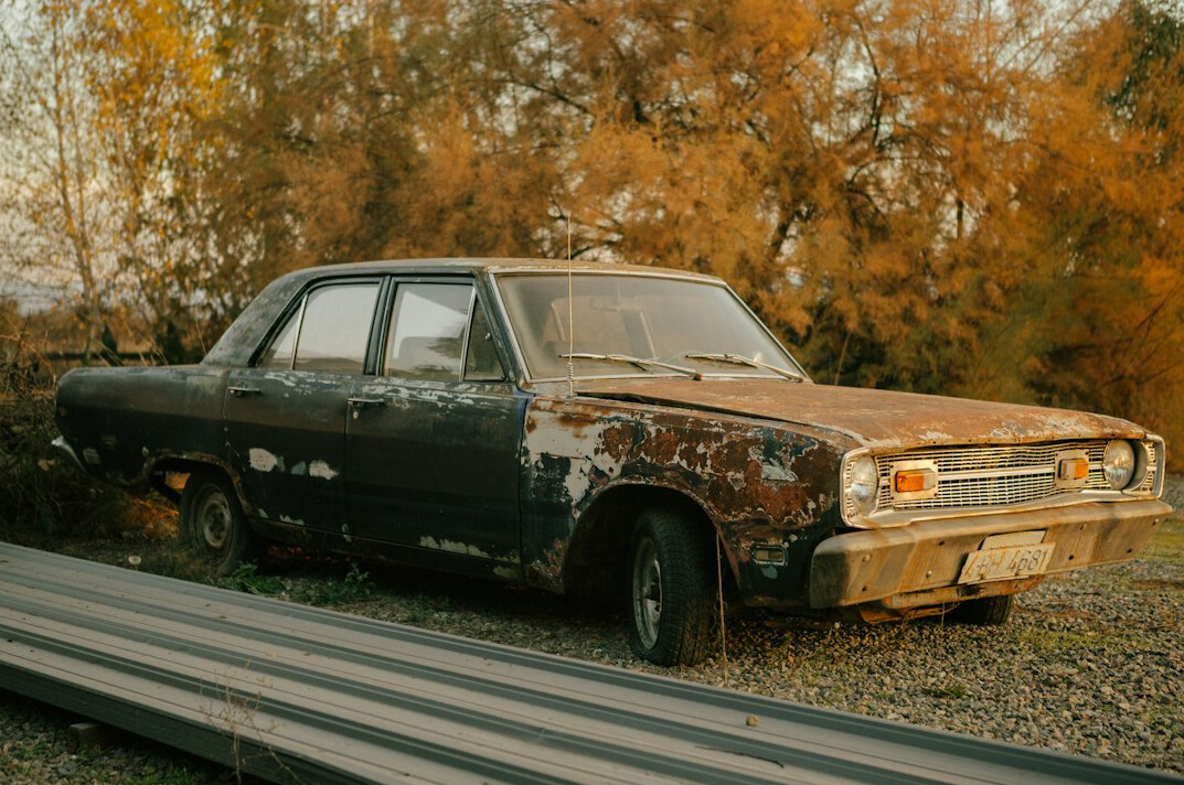 Older car with faded dull paint